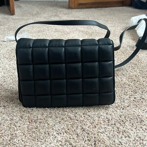 Purse with adjustable strap. Pleather. Like new. Clean inside and out.